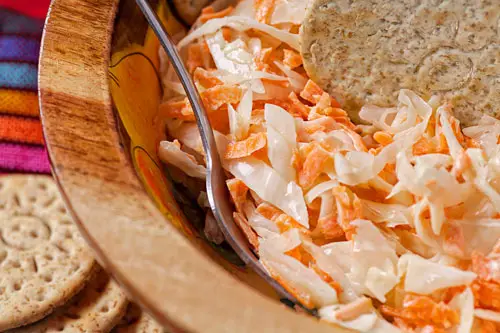 Coleslaw salad accompanied with crackers